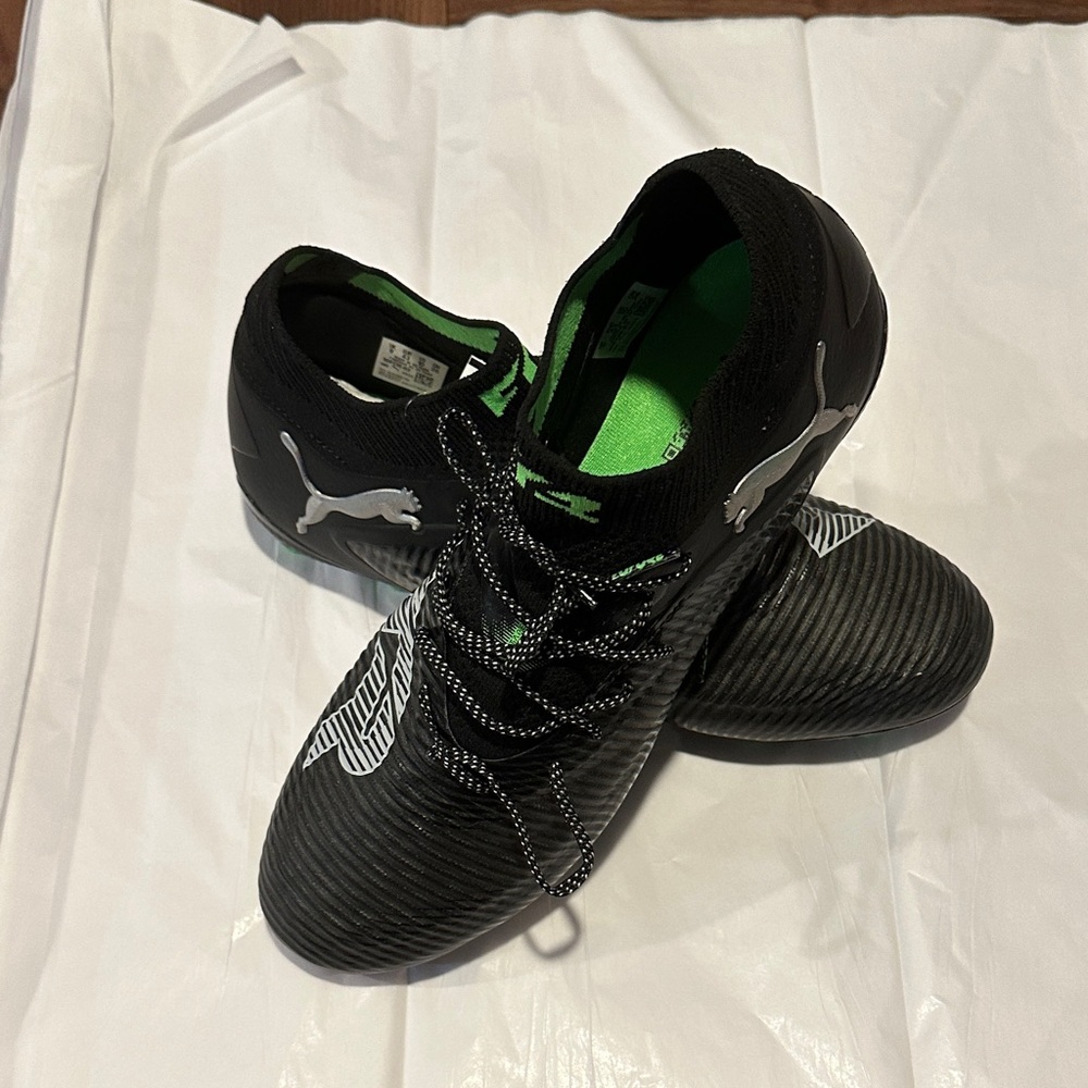 Puma Black and Green soccer cleats.